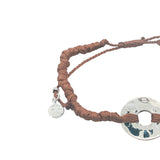Colored cord bracelet and hammered hole piece