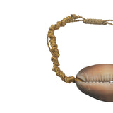 Gold braided cord and shell bracelet