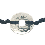 Colored cord bracelet and hammered hole piece