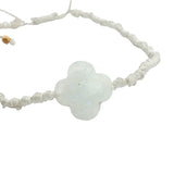 Gold cord bracelet with clover and faceted stone