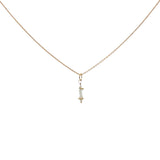 Golden necklace with stone pendant and golden balls