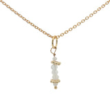 Golden necklace with stone pendant and golden balls