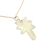 Gold necklace and natural stone palm tree