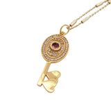 Collier doré clef tourmaline rose zircons 50 cm