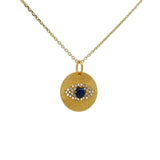 Collier doré médaille oeil lapis et zircons