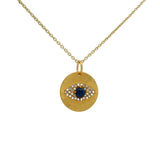 Collier doré médaille oeil lapis et zircons
