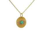 Gold necklace with eye medal and zircons