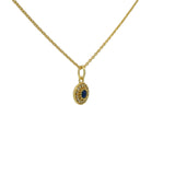 Gold necklace with small round stone and zircon medal
