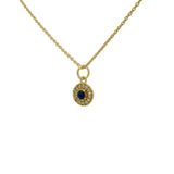 Gold necklace with small round stone and zircon medal
