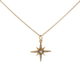 Collier doré pendentif rose des vents pierre et zircons