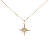 Gold necklace with compass rose pendant, stone and zircons