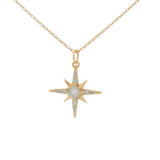 Gold necklace with compass rose pendant, stone and zircons