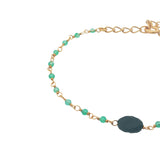 Golden bracelet with faceted stones and small stones