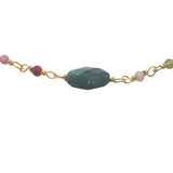 Golden bracelet with faceted stones and small stones