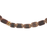 Golden necklace with elongated coconut wood beads