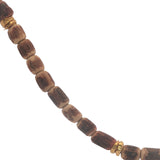 Golden necklace with elongated coconut wood beads