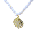 Collier doré coquillage et zircons 80 cm