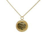 Gold necklace with oval stone pendant and balls