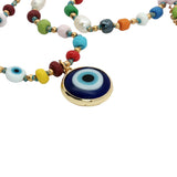 Collier perles de culture, fantaisies et oeil bleu 42cm