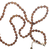Collier doré perles marrons en corne et noeuds marrons 64 cm