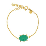 Golden bracelet with oval stone and zircons