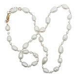 Collier doré alternance petites et grandes perles de culture avec noeuds beige 50 cm