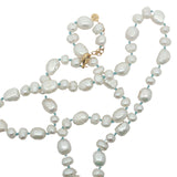Collier doré perles de culture,de différentes tailles avec noeuds turquoise 60 cm