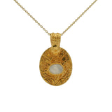 Gold necklace with engraved flower and stone pendant