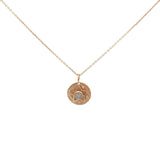 Gold necklace with star and stone medal