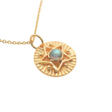 Gold necklace with star and stone medal