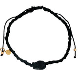 Black skull cord bracelet with gold beads
