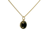 Gold necklace with round stone and zircon pendant