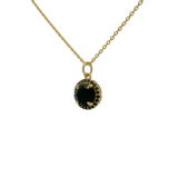 Gold necklace with round stone and zircon pendant