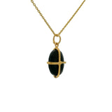 Gold necklace with gold cage stone pendant