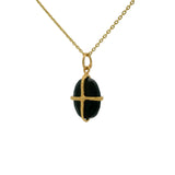 Gold necklace with gold cage stone pendant