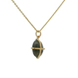 Gold necklace with gold cage stone pendant