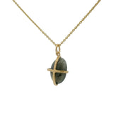 Gold necklace with gold cage stone pendant