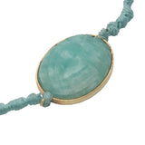 Bracelet cordon bleu turquoise scarabée taillé dans amazonite cerclée de doré