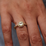 Golden solitaire ring with zircons and square stone