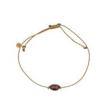 Bracelet doré avec perle de culture grise