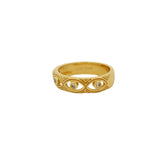 Gold ring with hollow eye and zircons