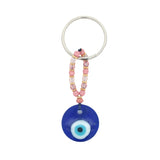 Porte-clefs oeil rond en pâte de verre soufflé bleu mix perles roses
