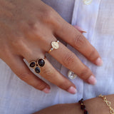 Golden ring with trio of stones