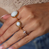 Gold ring with drop stone and zircons