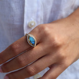 Golden signet ring with labradorite and zircons