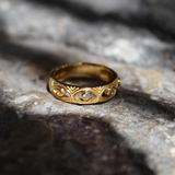 Gold ring with hollow eye and zircons