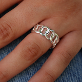 Silver ring with intertwined links