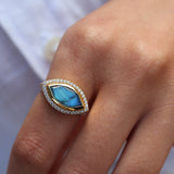 Golden signet ring with labradorite and zircons