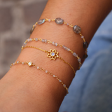 Golden bracelet with oval stones and small stones