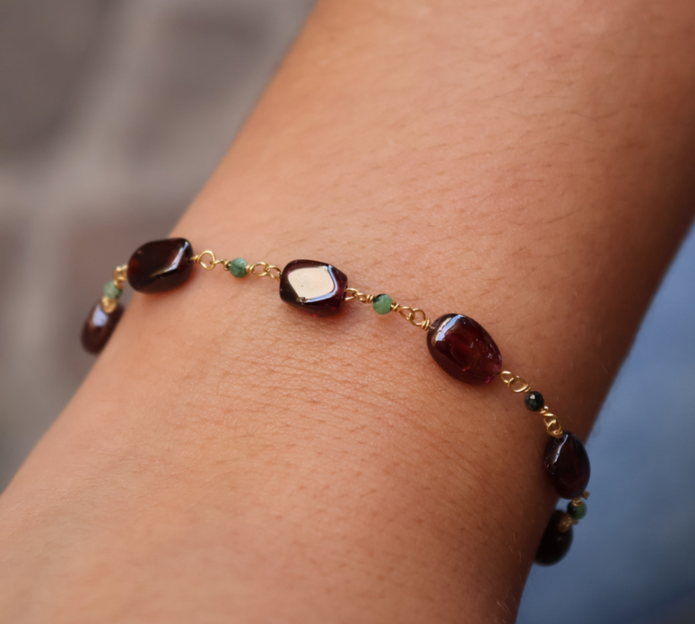 Golden bracelet with oval stones and small stones